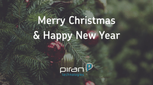 The text 'Merry Christmas and Happy New Year' over a Christmas tree background with the Piran Tech logo